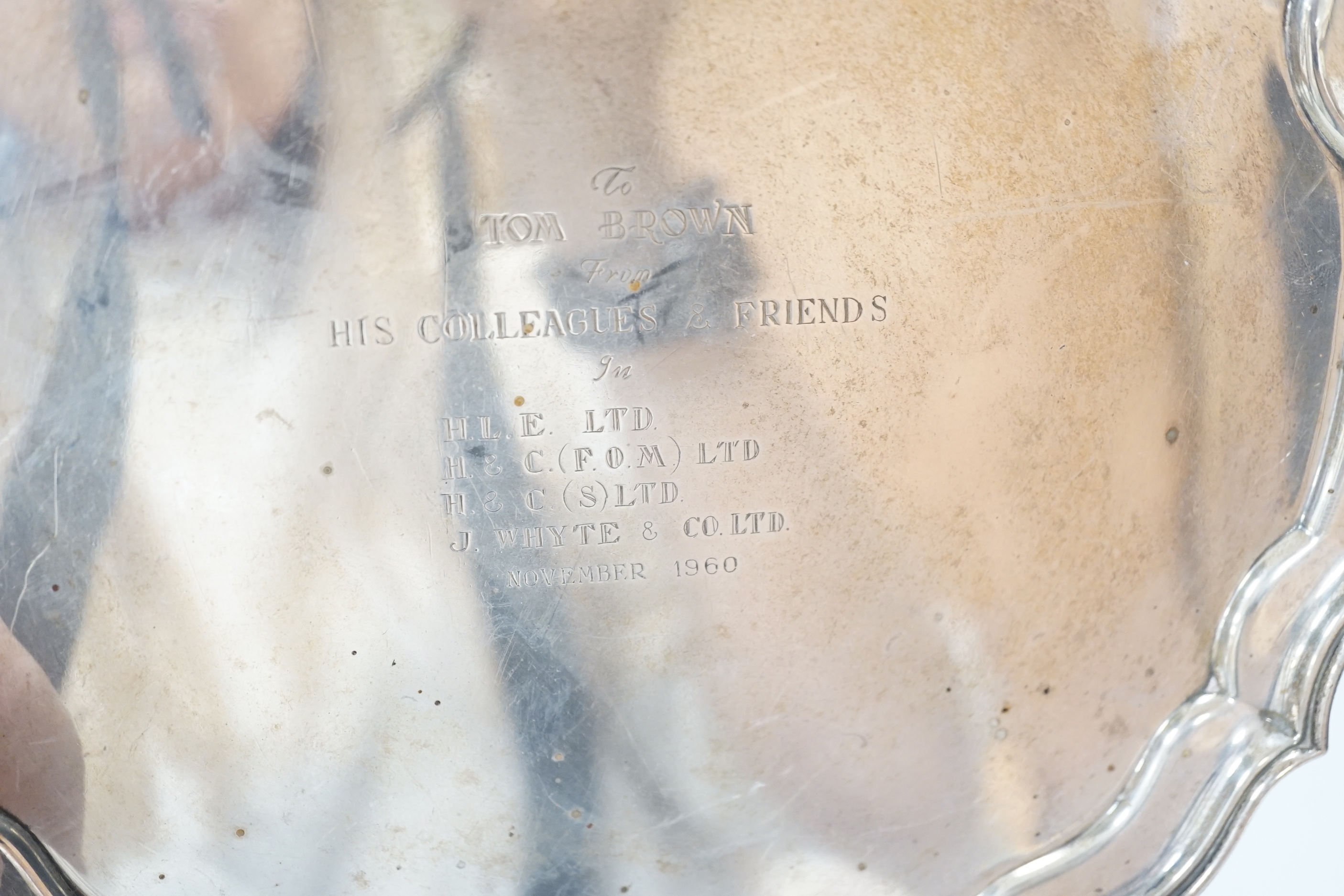 An Elizabeth II silver salver, with 1960 presentation inscription, piecrust rim and scroll feet, Birmingham 1959, 25.5cm, 516 grams